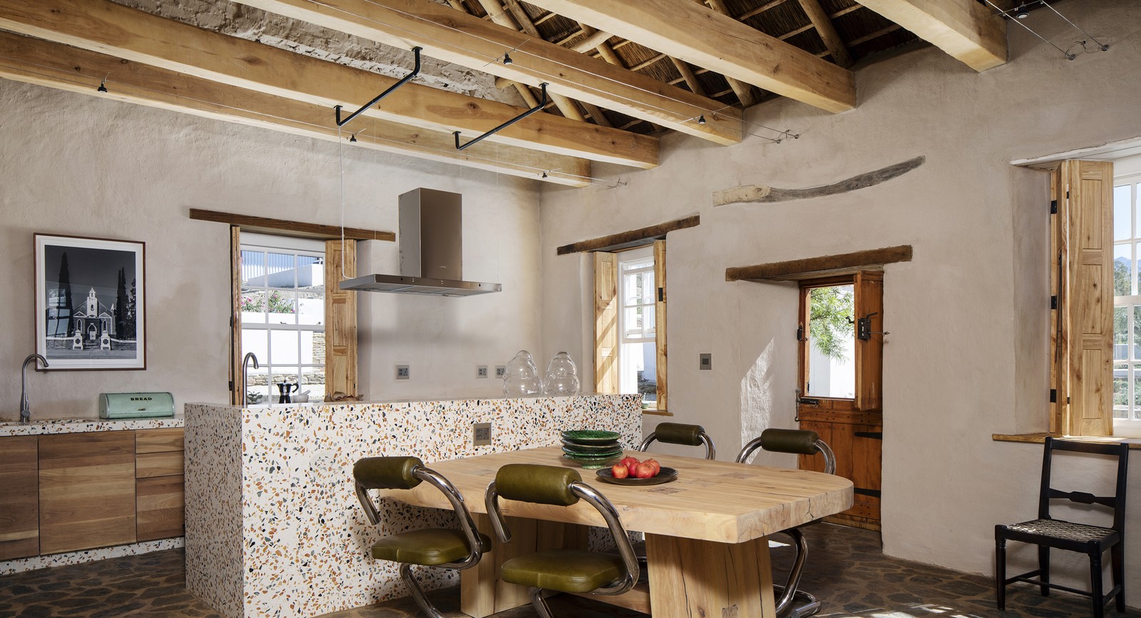 Buffelsdrift — kitchen, terrazzo island under the reed ceiling